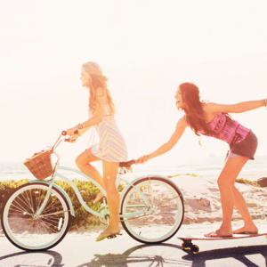 Biking and having fun with friends on the beach