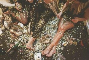 girls on the floor party with glitter