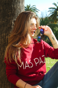 model brown hair smiling red sweater mas paz
